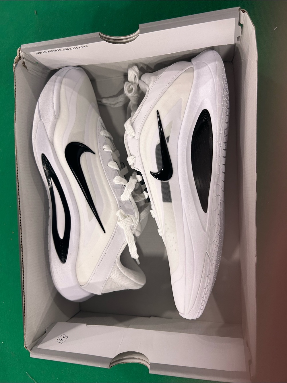 Nike Kids White Sneakers with Black Swoosh Accents